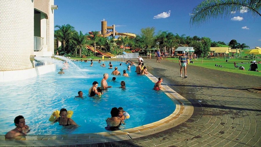 Bela-Bela showing a pond, a luxury hotel or resort and swimming