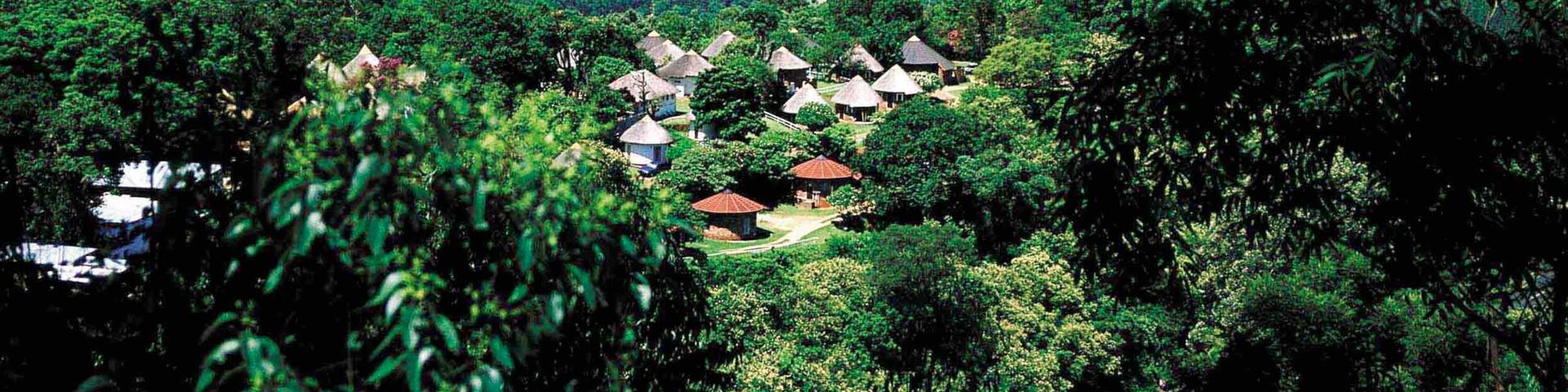 Magoebaskloof which includes mountains, a small town or village and landscape views