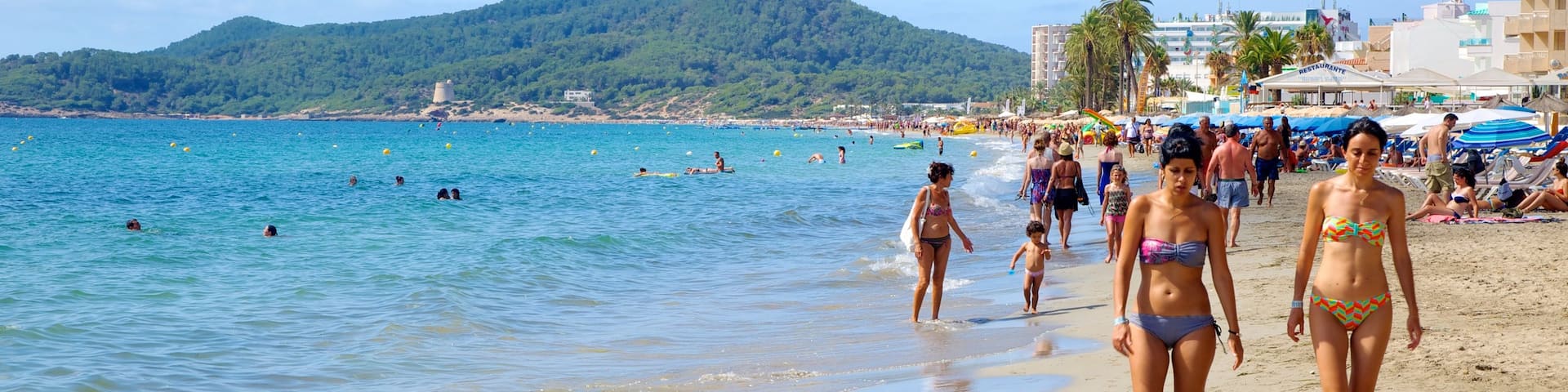 Playa d\'en Bossa which includes swimming, a beach and a luxury hotel or resort