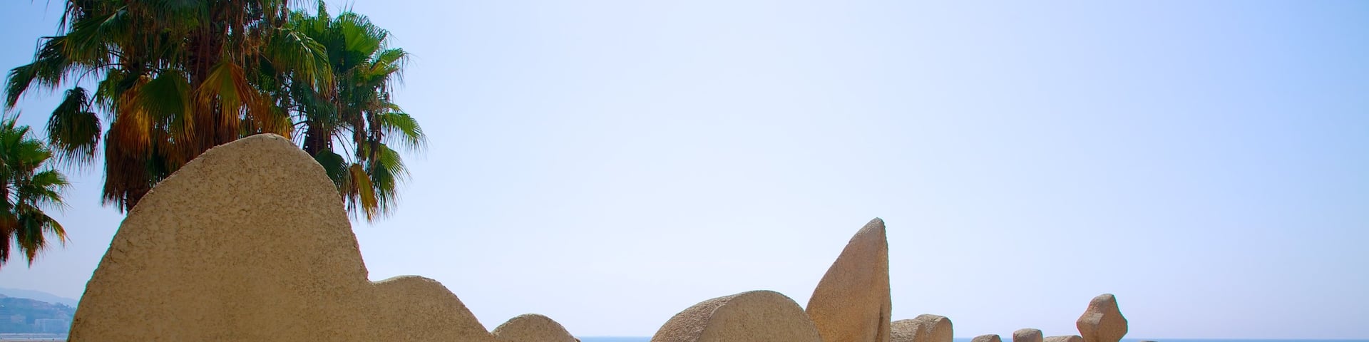 Malagueta Beach showing signage and a beach