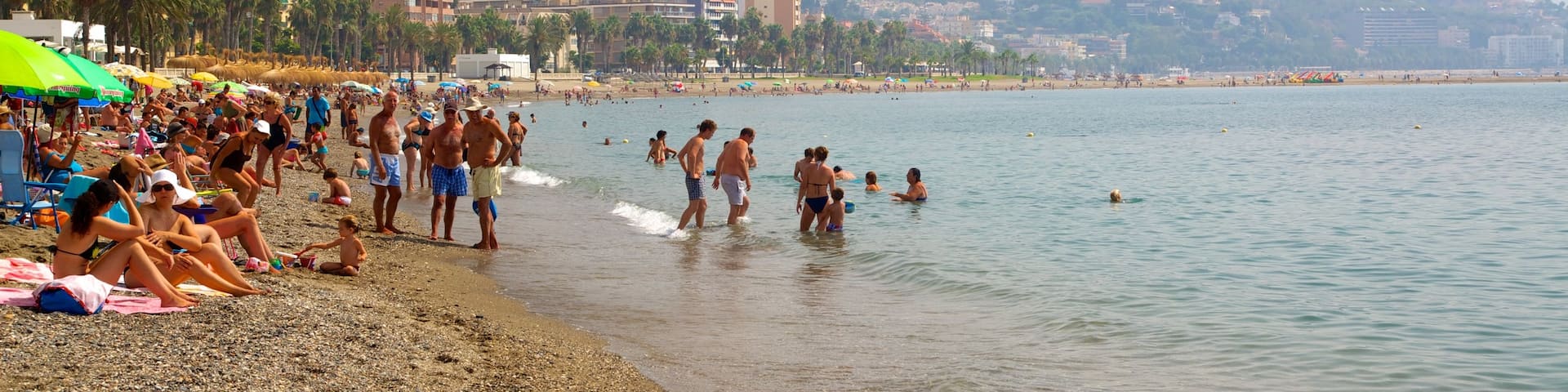 Malagueta Beach which includes swimming, a beach and a coastal town