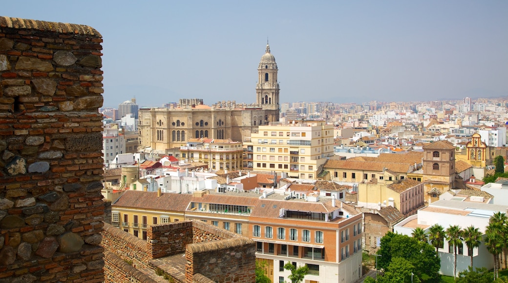 Alcazaba featuring a church or cathedral, a city and heritage architecture