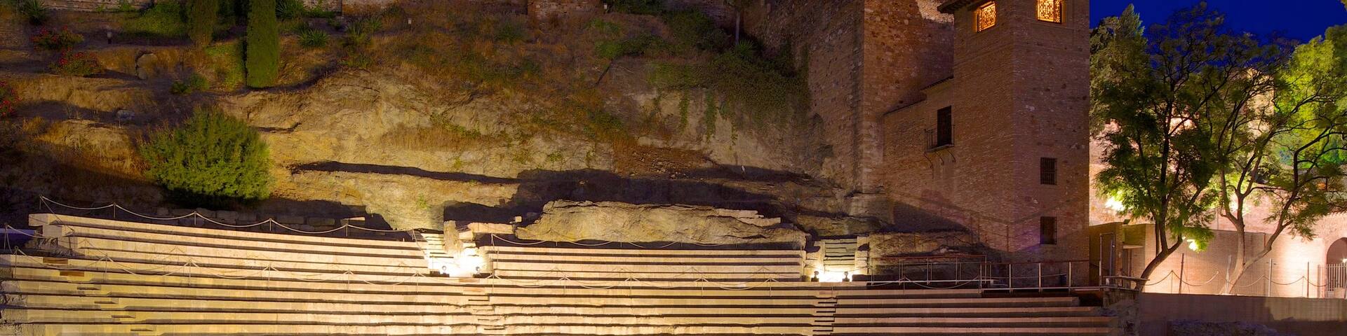 Malaga Amphitheatre showing building ruins, night scenes and heritage architecture