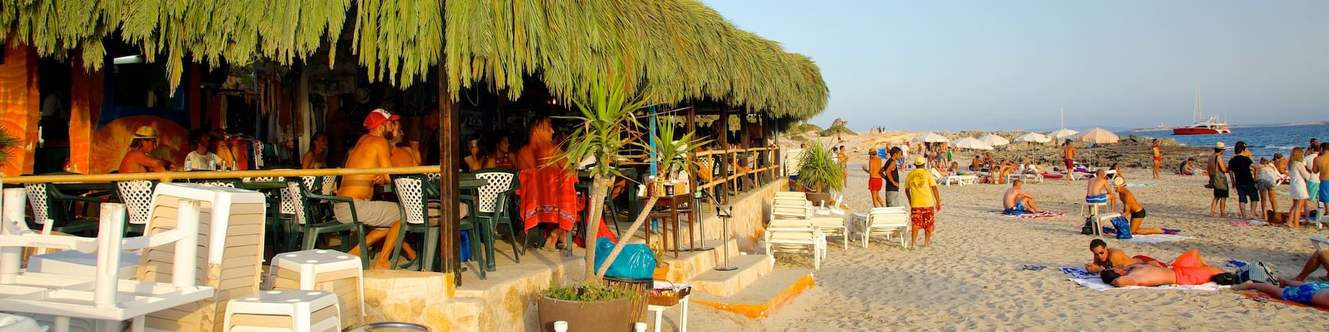 Las Salinas Beach which includes signage, a beach and a coastal town