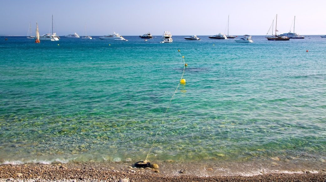 Cala Jondal Beach featuring a bay or harbour, a sandy beach and boating
