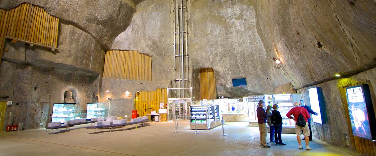 Wieliczka Salt Mine featuring caves and interior views