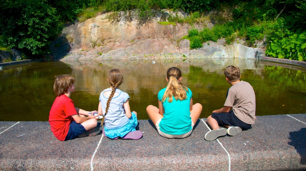 Stockholm showing a pond as well as children