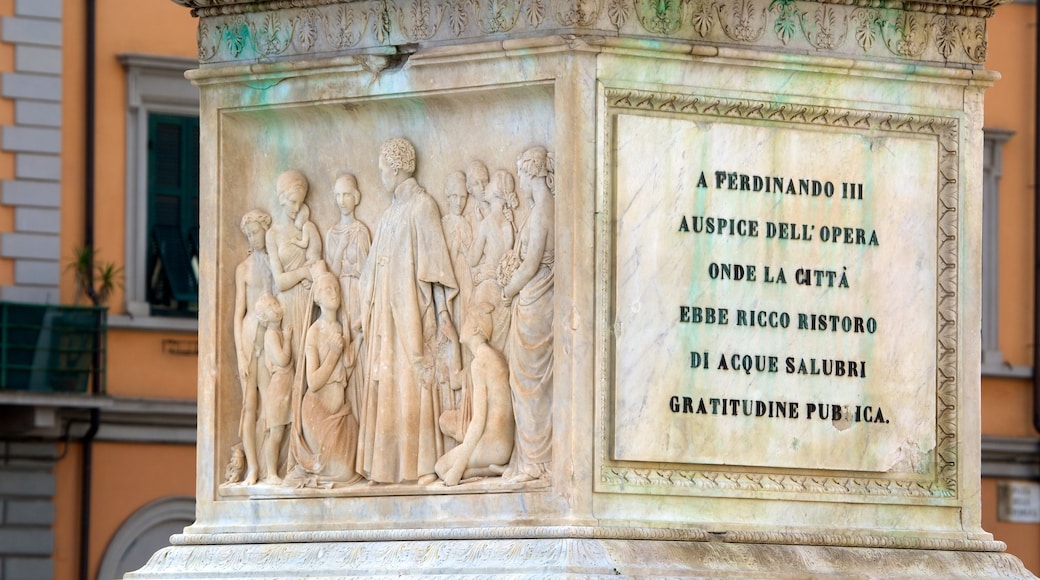 Piazza della Repubblica featuring signage, a monument and art