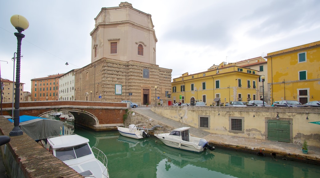 Chiesa di Santa Caterina featuring a bridge, a river or creek and boating