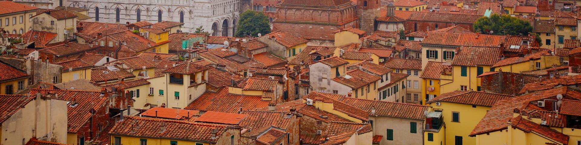 Torre delle Ore which includes heritage architecture and a city