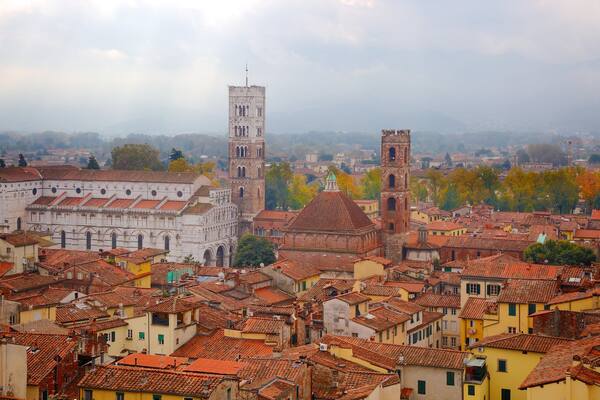 Torre delle Ore which includes heritage architecture and a city