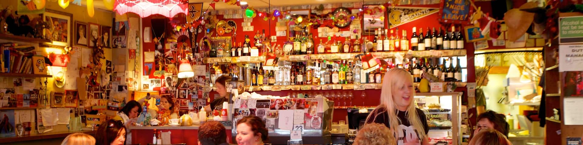 Courtenay Place featuring a bar and interior views as well as a small group of people