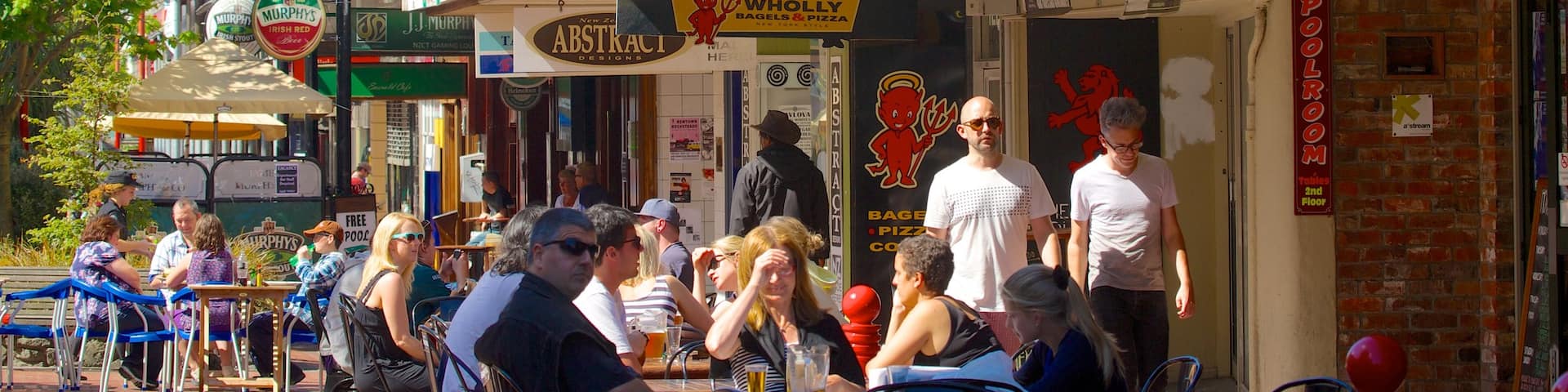 Cuba Street Mall featuring cafe scenes and outdoor eating as well as a large group of people