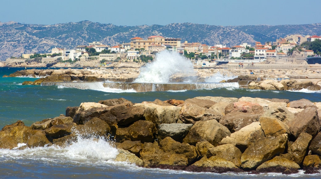 Prado Beach featuring rugged coastline and a coastal town