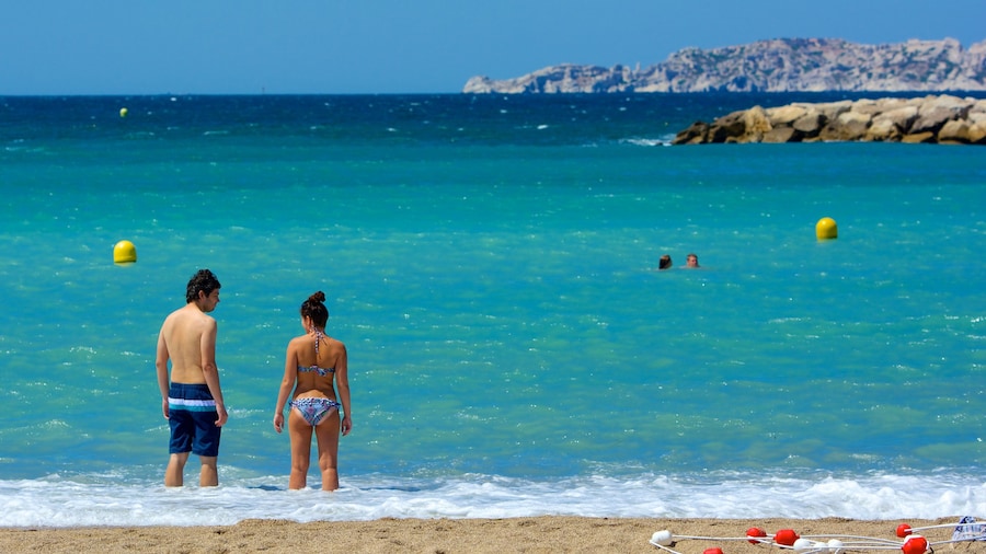 Prado Beach which includes swimming, general coastal views and a beach
