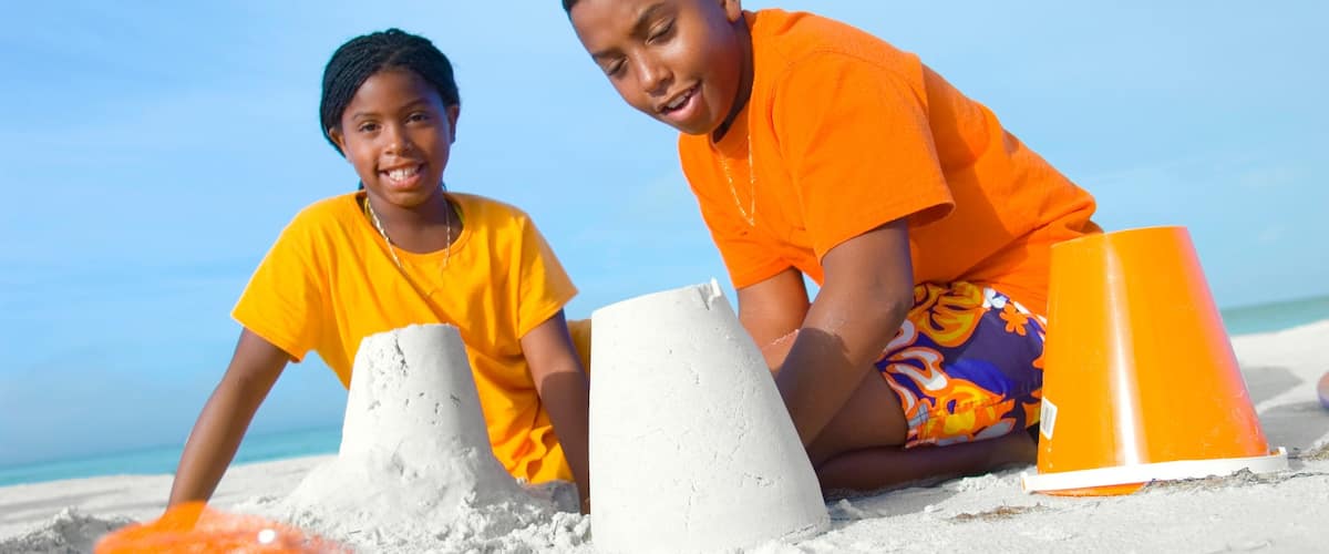 Sarasota which includes a sandy beach as well as children
