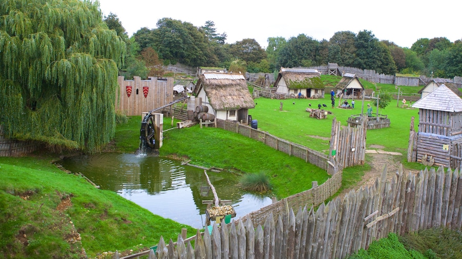 Mountfitchet Castle featuring a pond, a castle and heritage elements