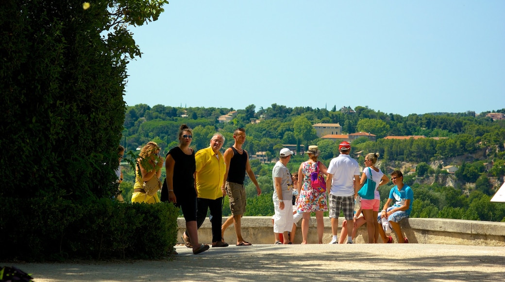 Parc des Expositions showing a small town or village as well as a large group of people