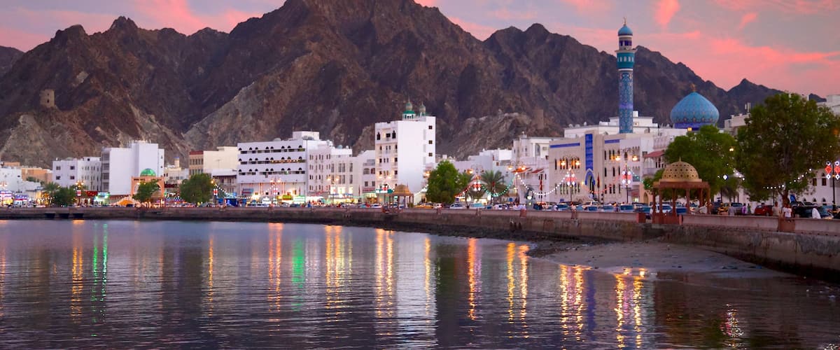 Muscat featuring general coastal views and a sunset