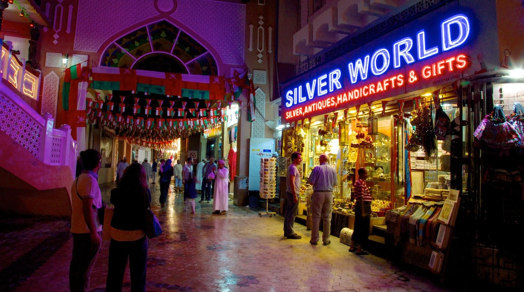 Muttrah Souq showing signage, nightlife and shopping