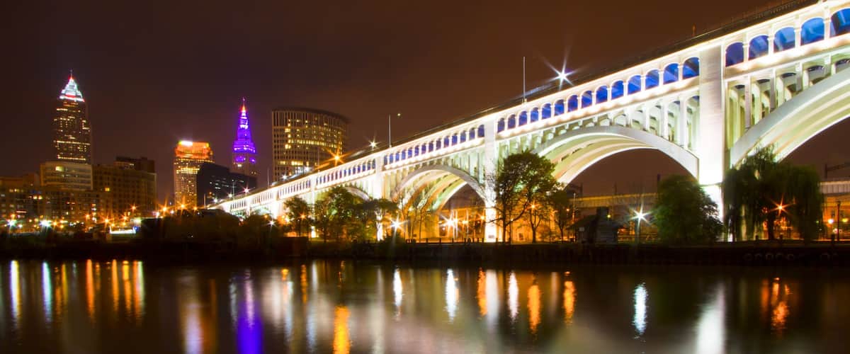 Cleveland showing night scenes, a city and a bridge