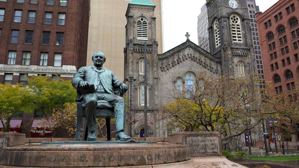 Old Stone Church showing a city, a square or plaza and a statue or sculpture