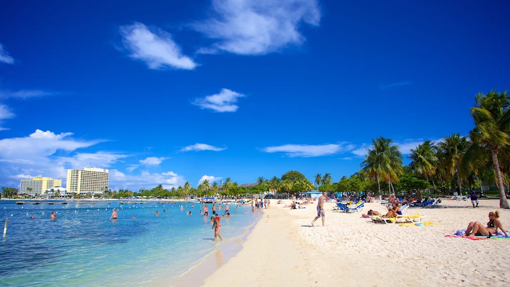 Ocho Rios featuring a sandy beach, tropical scenes and swimming