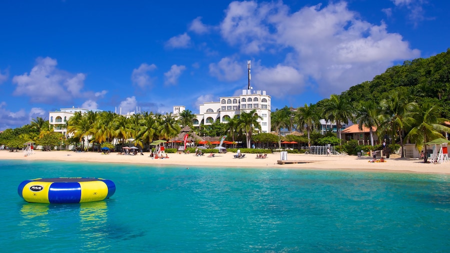 Doctor\'s Cave Beach featuring a beach, a coastal town and tropical scenes
