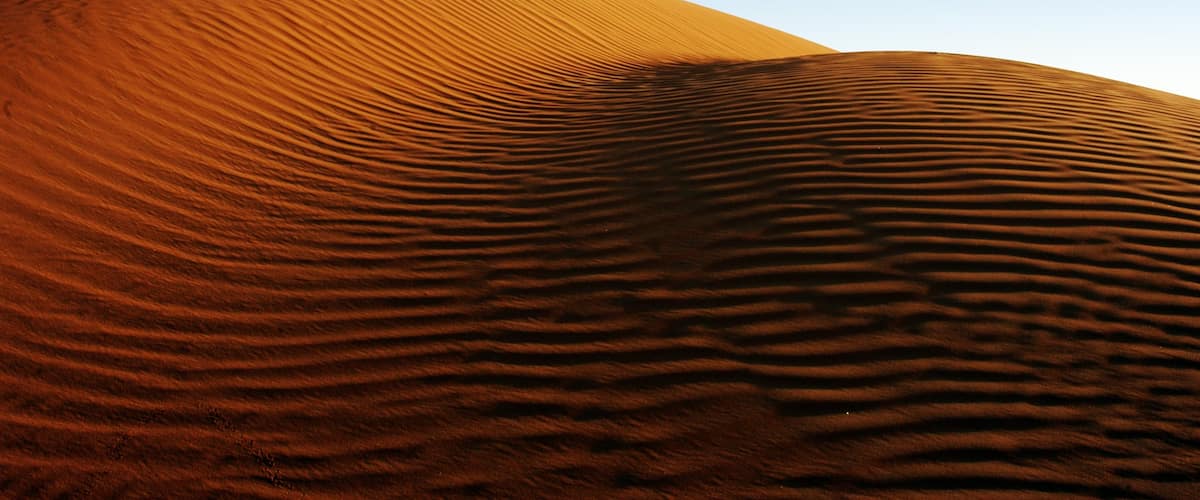 Emirato de Abu Dabi que incluye vistas al desierto, una puesta de sol y vistas de paisajes