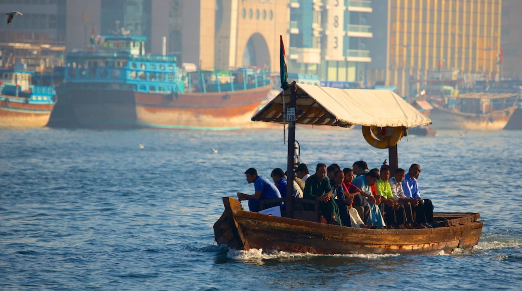 Dubai Creek showing a bay or harbour, boating and a coastal town