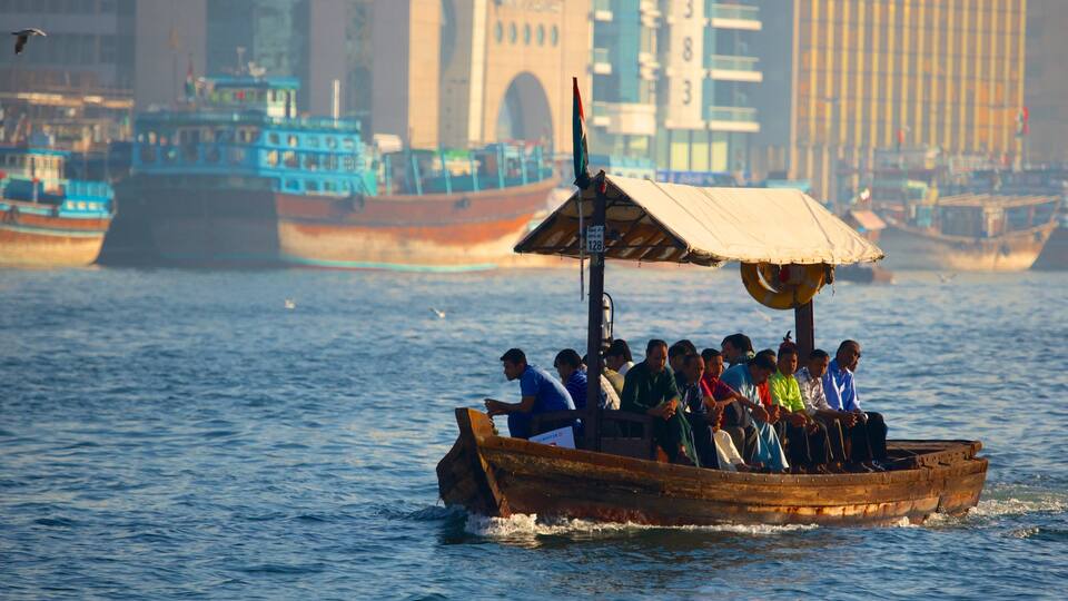 Dubai Creek showing a bay or harbour, boating and a coastal town