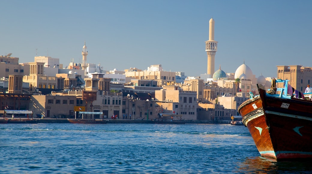 Dubai Creek showing a bay or harbour, central business district and skyline