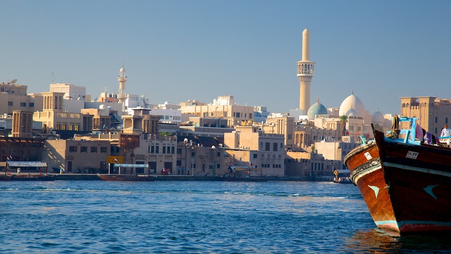 Dubai Creek which includes boating, a city and a bay or harbour