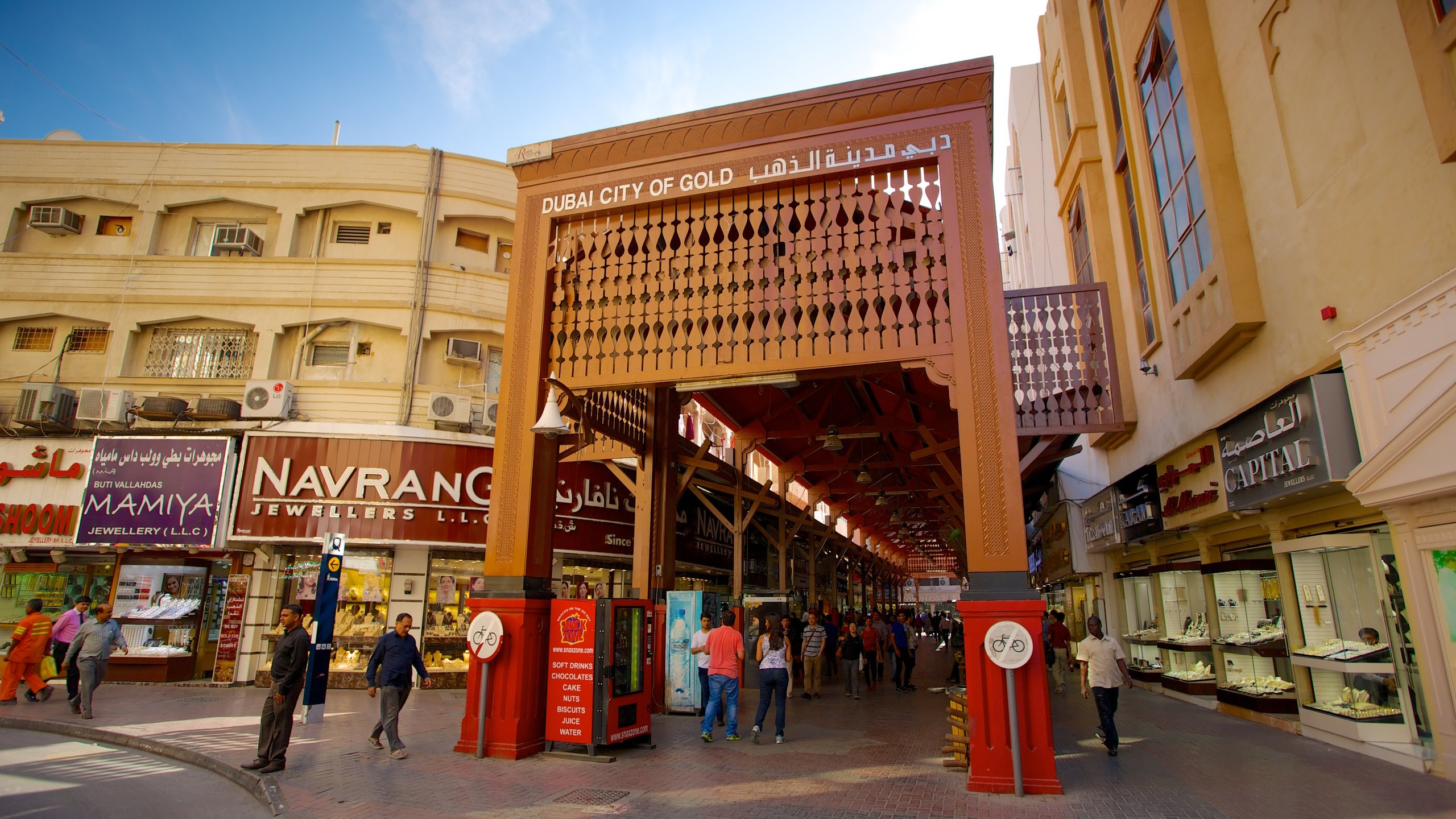 Gold Souk showing city views, a city and signage