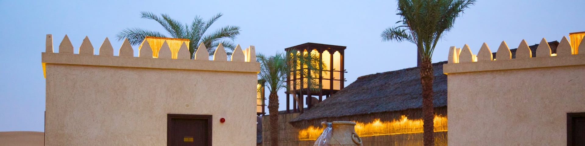 Abu Dhabi Emirate which includes a square or plaza, a small town or village and night scenes