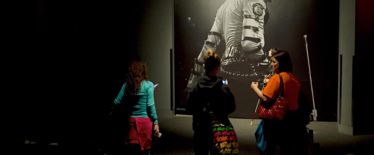 Rock and Roll Hall of Fame featuring interior views and music as well as a small group of people