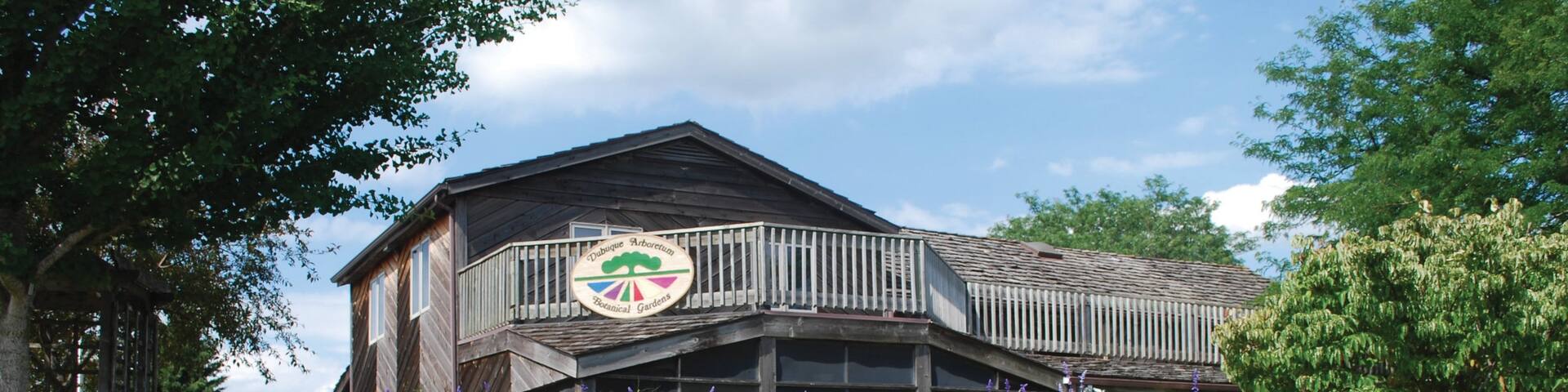 Downtown Dubuque showing a house, flowers and a garden