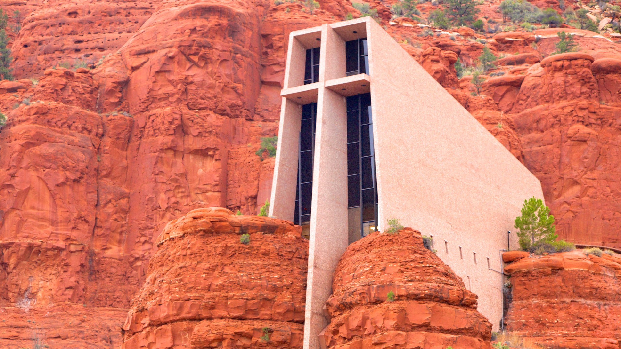 Chapel of the Holy Cross which includes modern architecture, a church or cathedral and a gorge or canyon