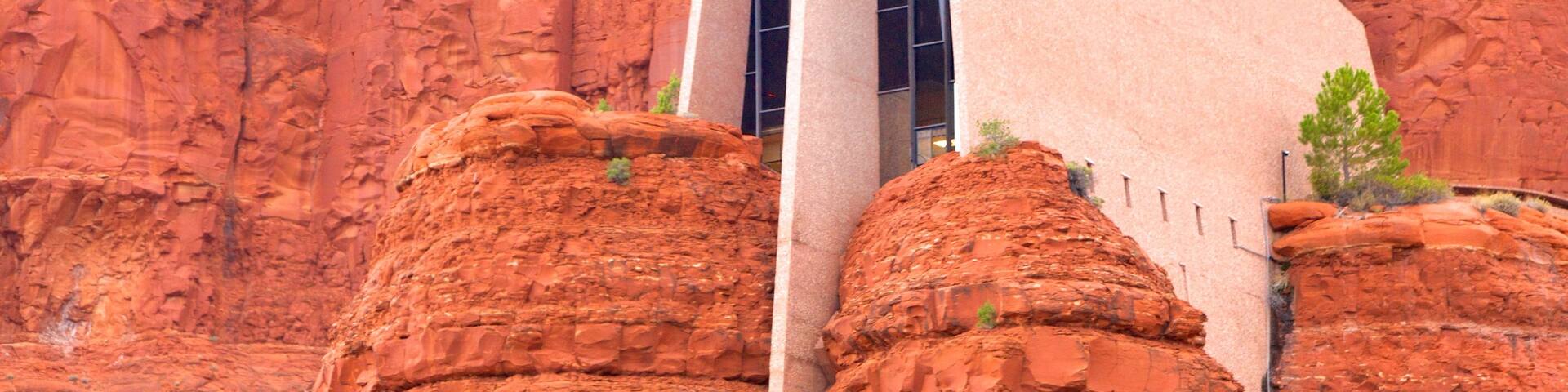 Chapel of the Holy Cross featuring a church or cathedral, a gorge or canyon and modern architecture