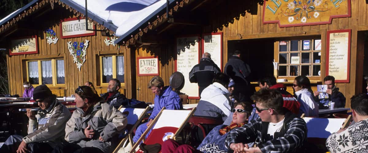 Morzine showing snow, signage and apres ski