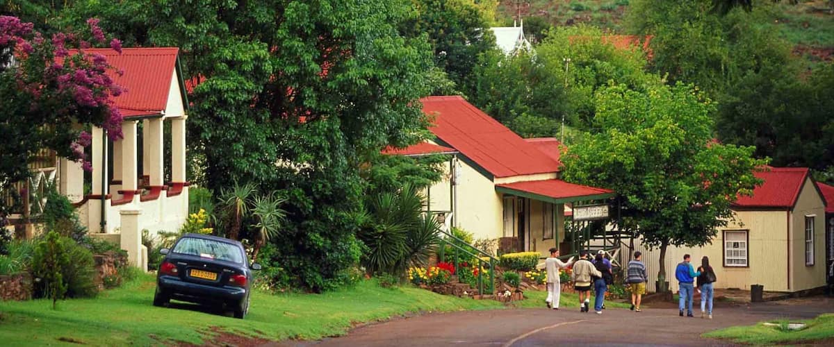 Pilgrims Rest which includes a small town or village, street scenes and a house