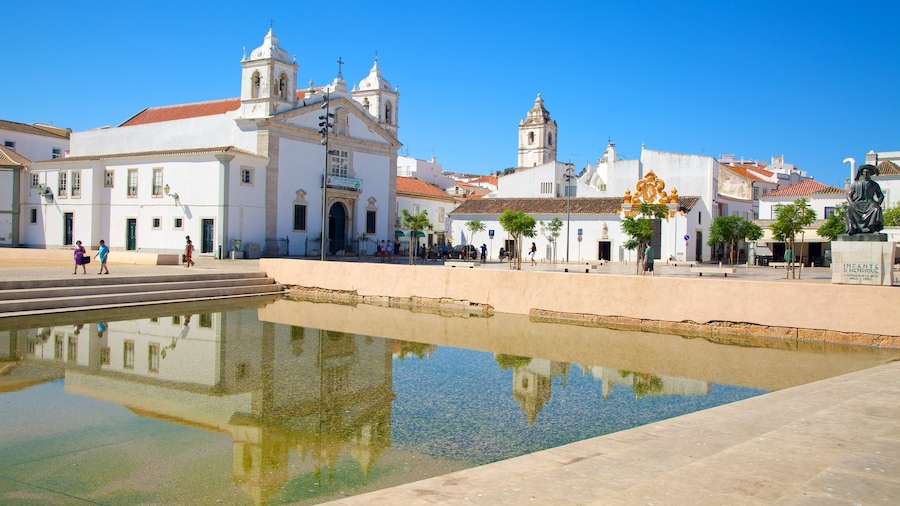 Algarve which includes a church or cathedral, a pool and a small town or village