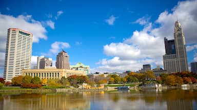 Columbus showing skyline, a pond and a city