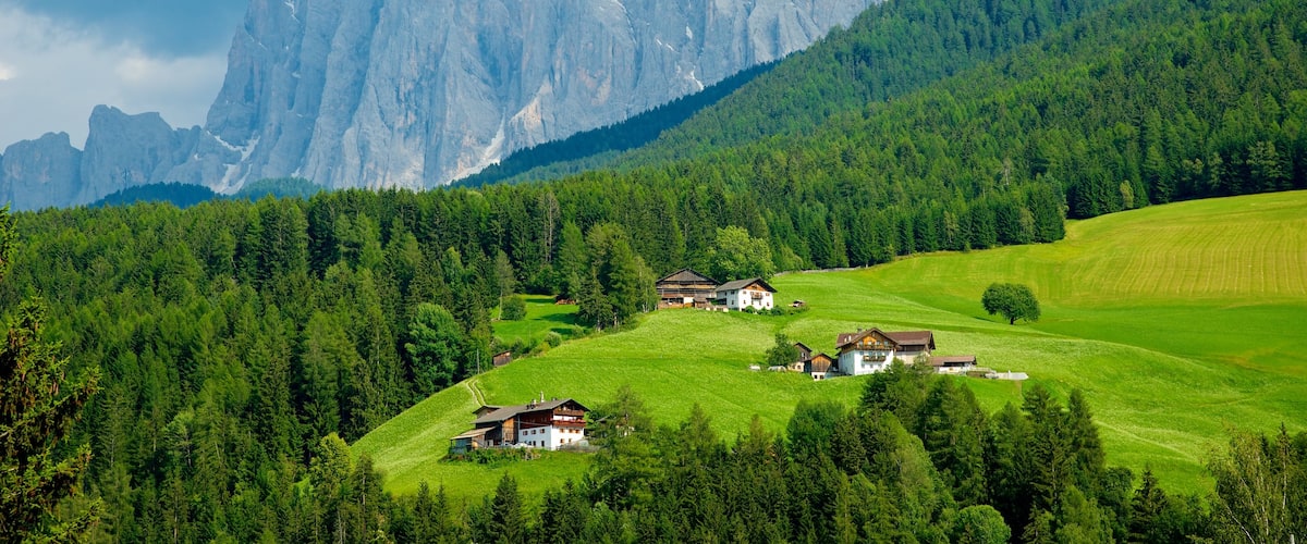 Funes featuring tranquil scenes, farmland and mountains