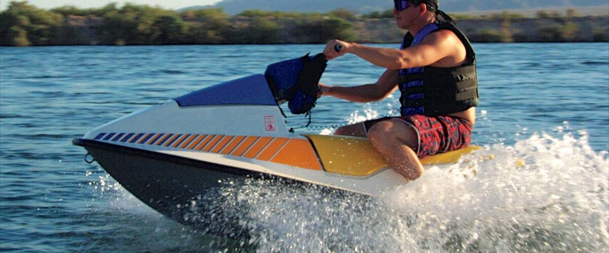 Bullhead City featuring jet skiing and a lake or waterhole as well as an individual male