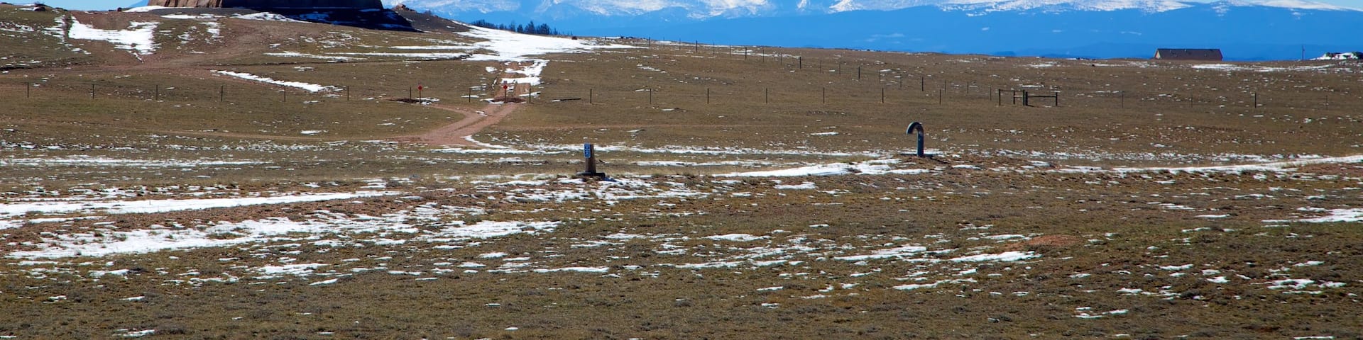 Laramie which includes tranquil scenes, snow and a monument