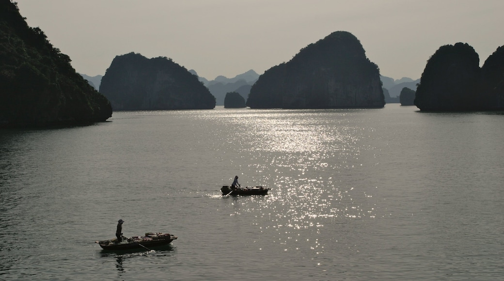 Halong Bay showing a bay or harbour, kayaking or canoeing and rocky coastline