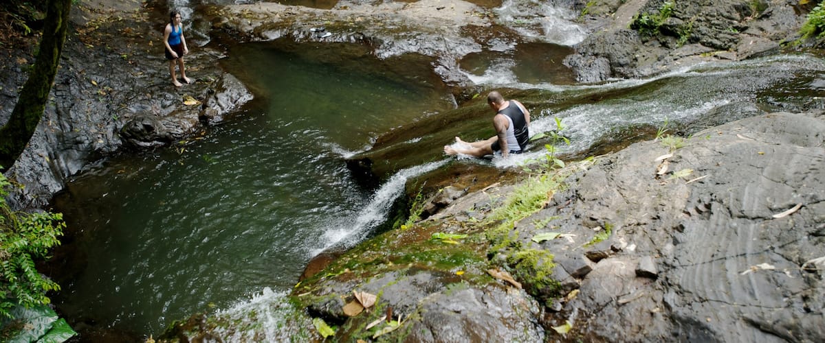 Upolu which includes rainforest and a river or creek as well as a couple
