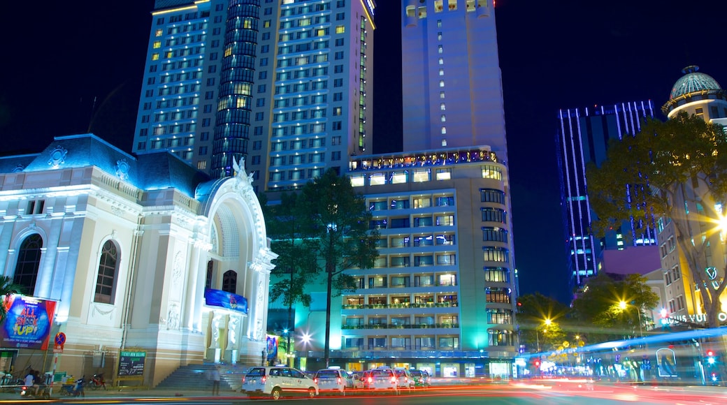 Opera House featuring a high-rise building, street scenes and a city