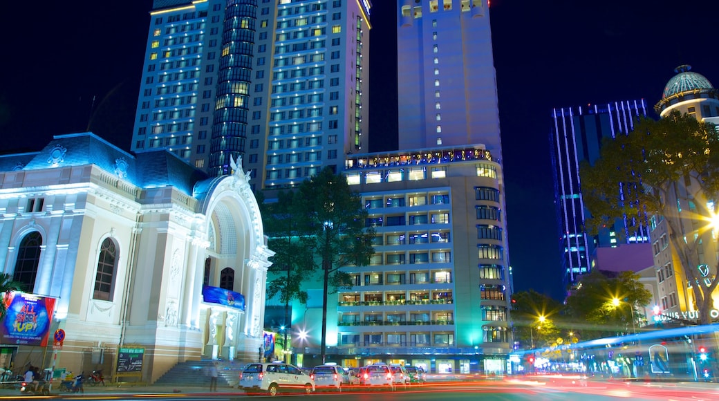 Opera House showing a city, a skyscraper and night scenes